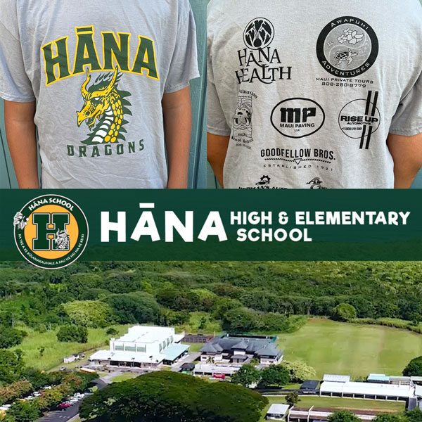 Two people in gray logo T-shirts embark on an adventure, captured in an aerial view of "Hāna High & Elementary School," nestled amid lush greenery and majestic mountains—a hidden gem for any Maui tour enthusiast.